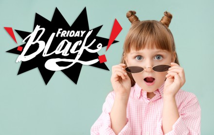 Surprised little girl and inscription BLACK FRIDAY on color background