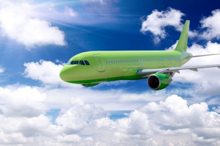 Modern airplane in a sky with clouds.